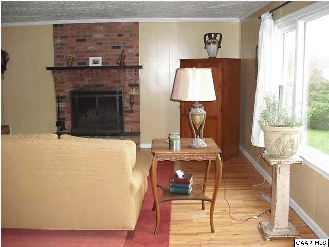 1453 Hanback Road Gordonsville, VA 22942 - Photo 10 of 12 a living room with furniture and a fireplace