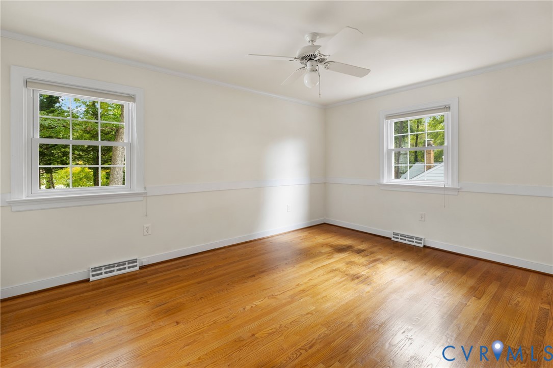 10062 Rinker Drive Mechanicsville, VA 23116 - Photo 16 of 34 a view of an empty room with a window and wooden floor