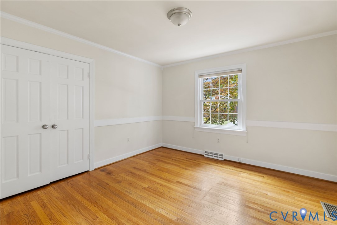 10062 Rinker Drive Mechanicsville, VA 23116 - Photo 18 of 34 wooden floor in an empty room with a window