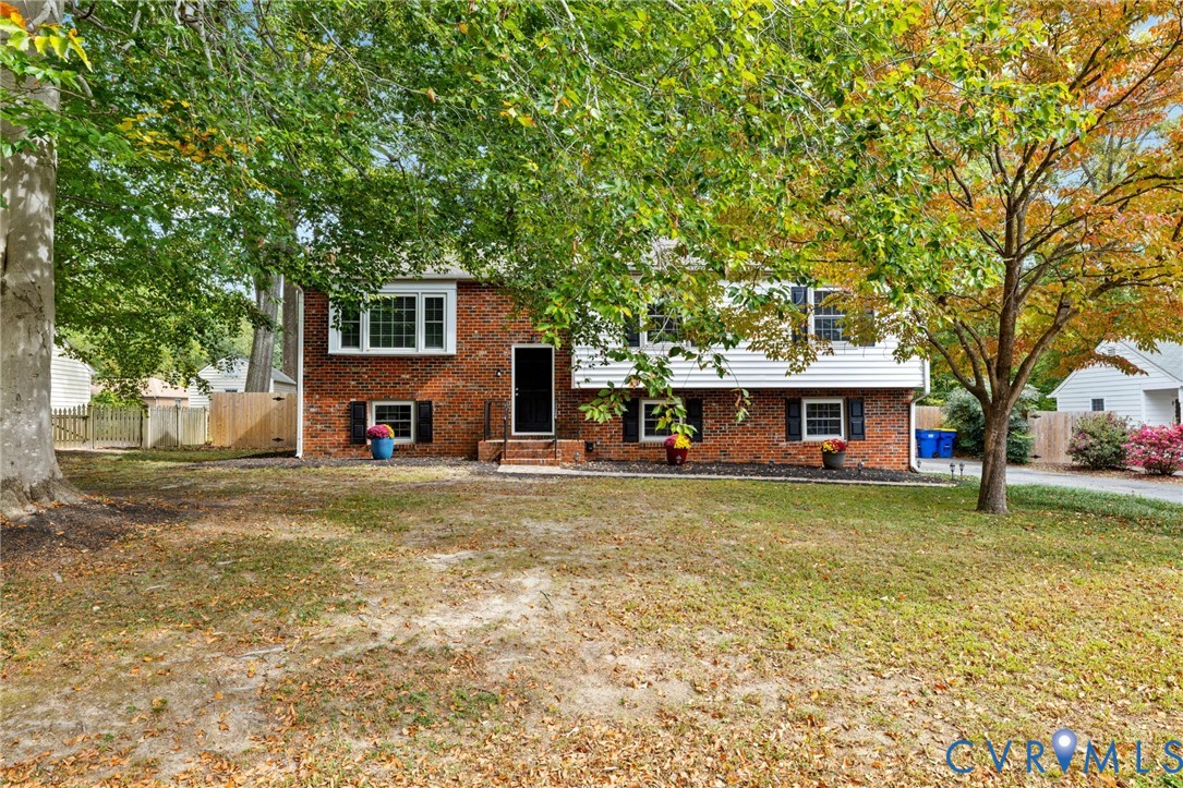 10062 Rinker Drive Mechanicsville, VA 23116 - Photo 2 of 34 a view of a yard in front of a house with large trees