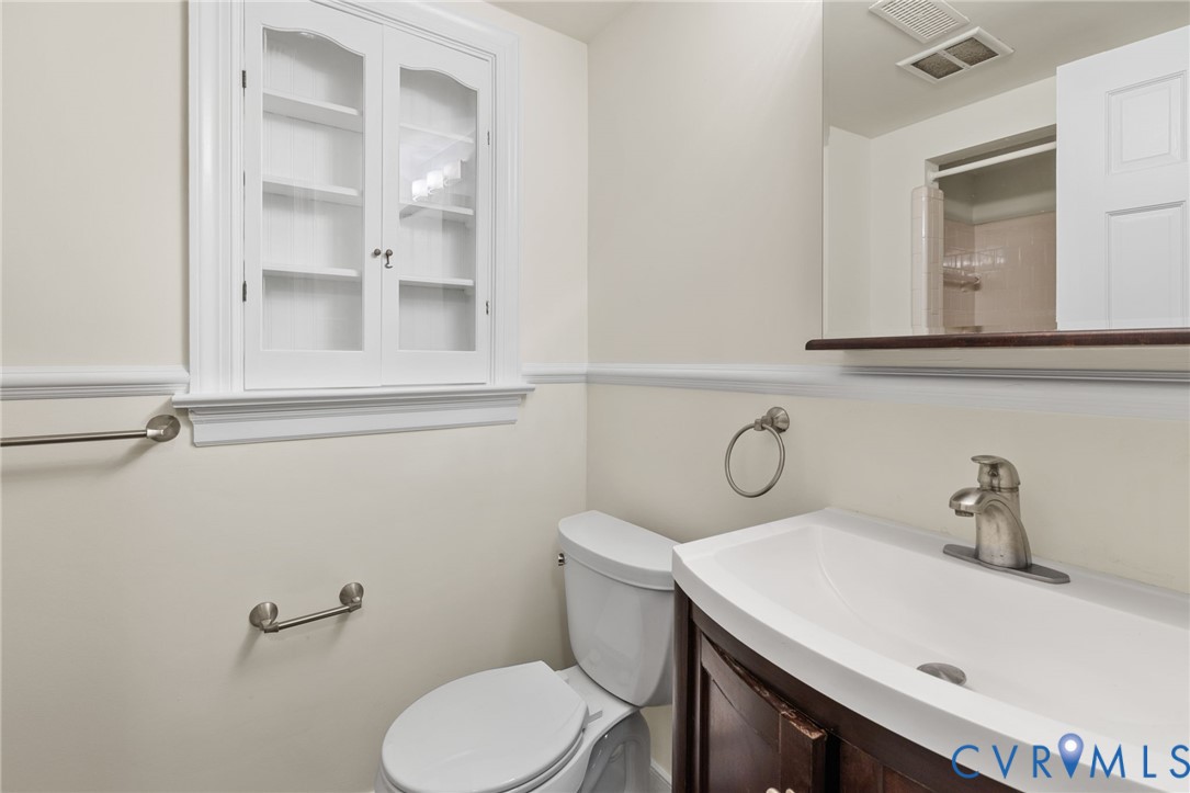 10062 Rinker Drive Mechanicsville, VA 23116 - Photo 25 of 34 a bathroom with a sink vanity and toilet