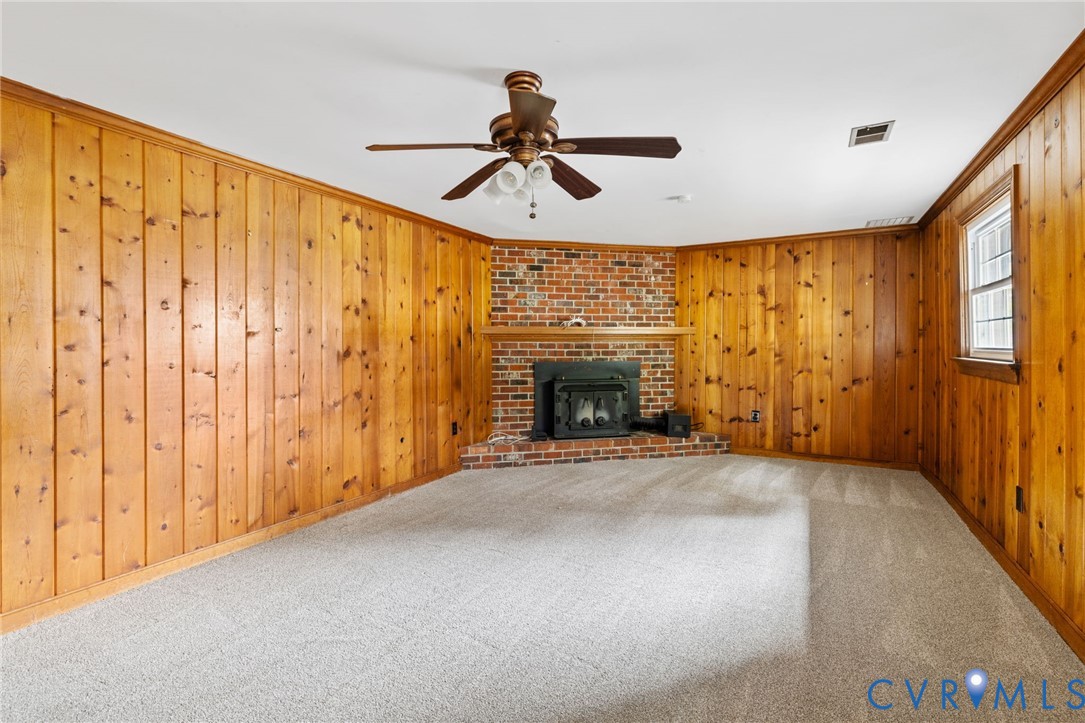 10062 Rinker Drive Mechanicsville, VA 23116 - Photo 27 of 34 a view of empty room with fireplace and fan