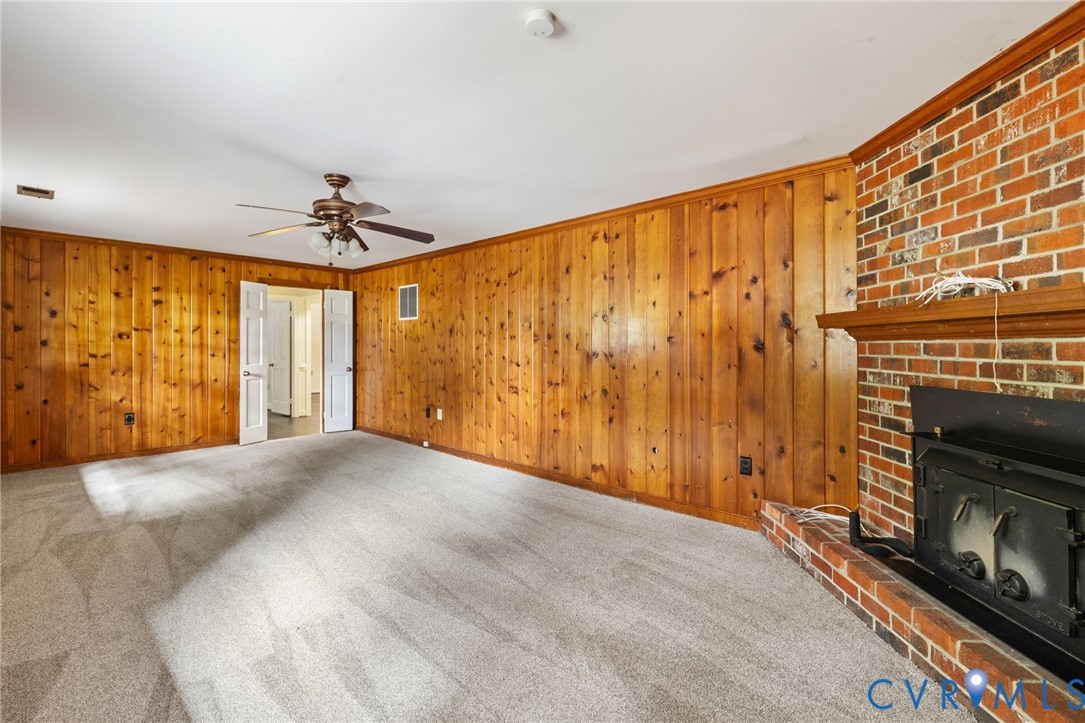 10062 Rinker Drive Mechanicsville, VA 23116 - Photo 28 of 34 a view of an empty room with a fireplace and a window