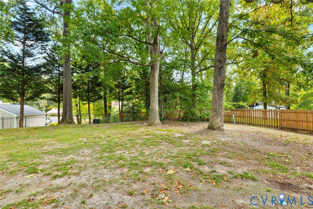 10062 Rinker Drive Mechanicsville, VA 23116 - Photo 32 of 34 a swimming pool with trees in the background