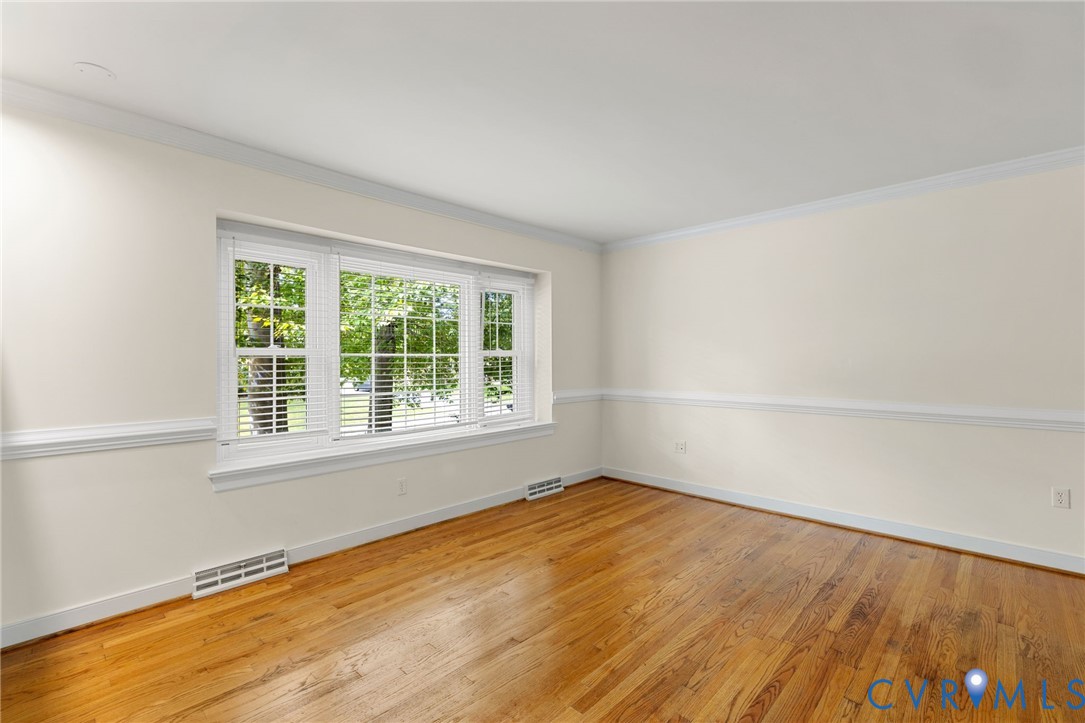 10062 Rinker Drive Mechanicsville, VA 23116 - Photo 5 of 34 wooden floor in an empty room with a window