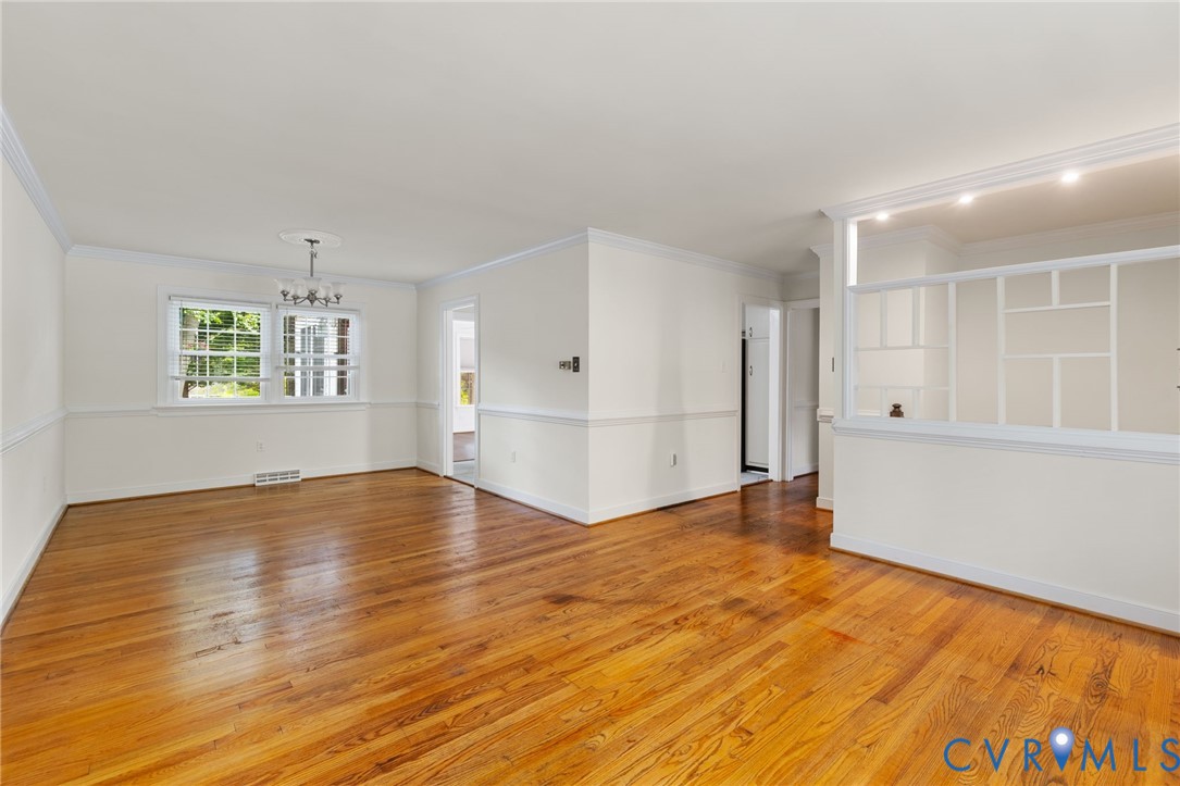 10062 Rinker Drive Mechanicsville, VA 23116 - Photo 7 of 34 a view of empty room with wooden floor and windows