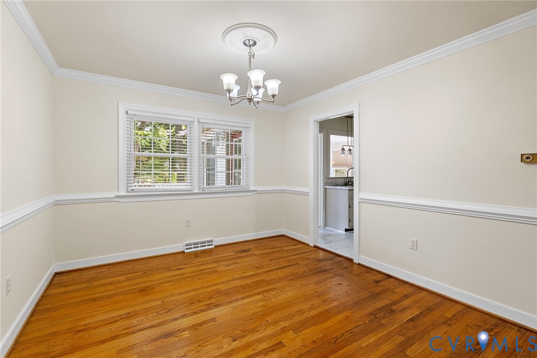 10062 Rinker Drive Mechanicsville, VA 23116 - Photo 8 of 34 wooden floor in an empty room with a window