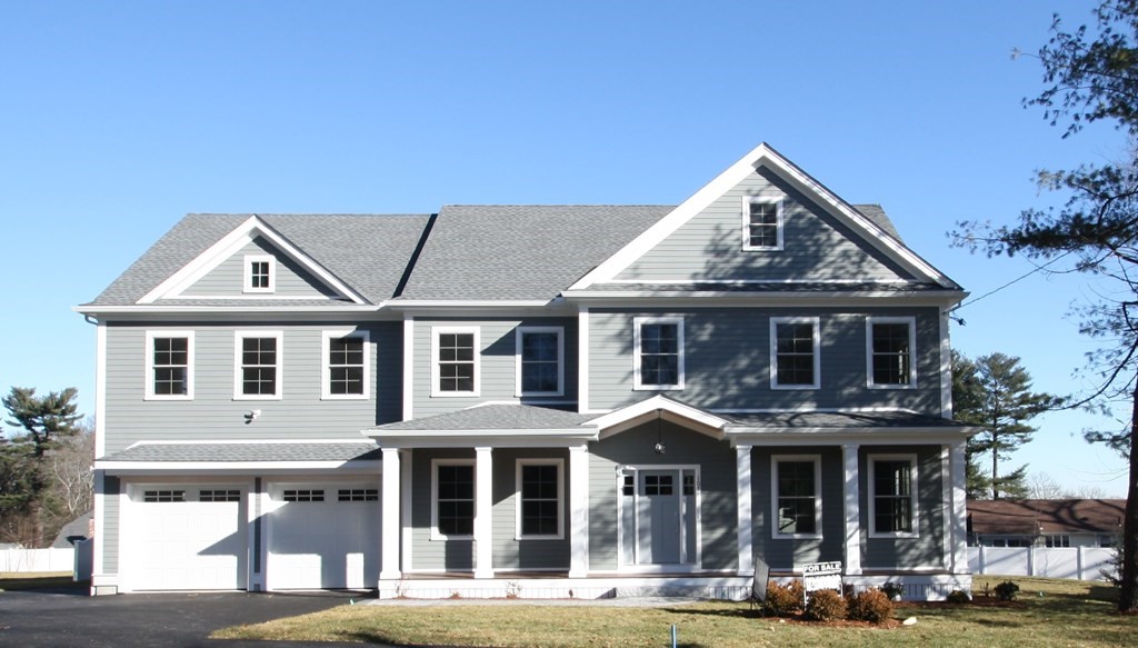 107 Thornton Road Needham, MA 02492 - Photo 1 of 1 a front view of a residential apartment building with a yard