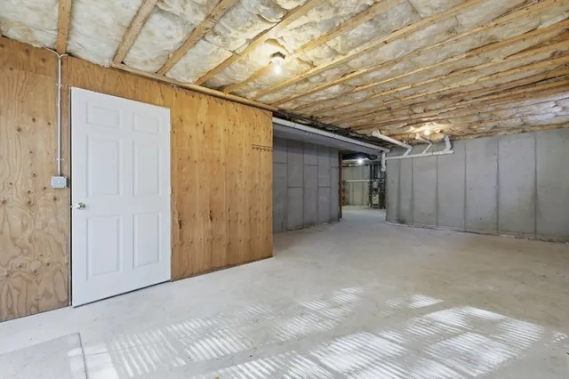 a view of empty room with wooden ceiling