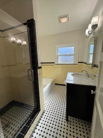 a bathroom with a sink and a shower