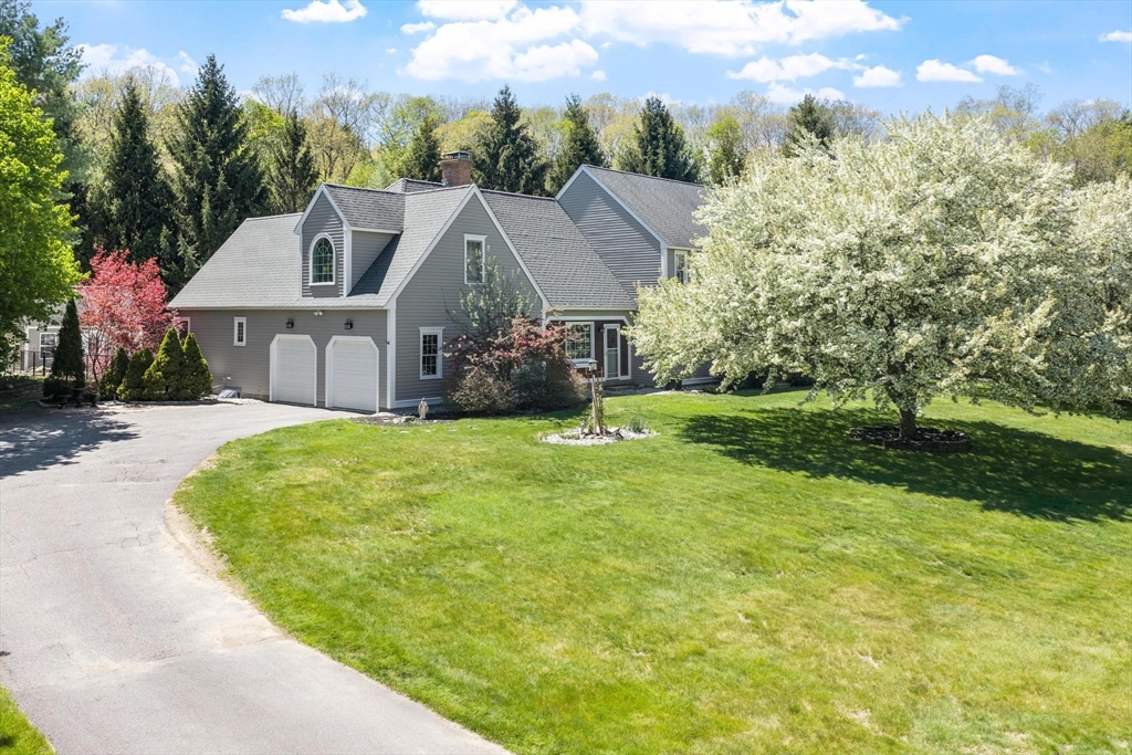4 Ridge Road Pepperell, MA 01463 - Photo 5 of 42 a view of a big house with a big yard plants and large trees