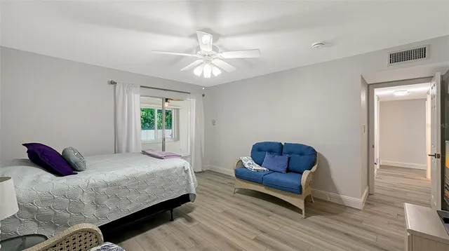 a bedroom with a bed and a couch