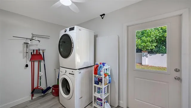 a view of house with backyard and porch