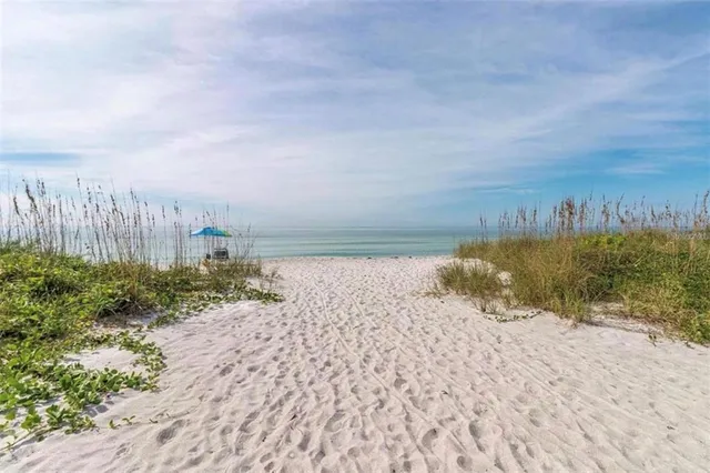 a swimming pool with outdoor seating and yard