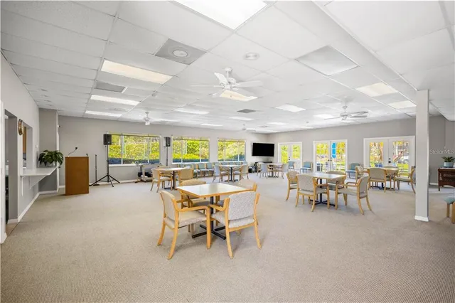 a view of a swimming pool with sitting area