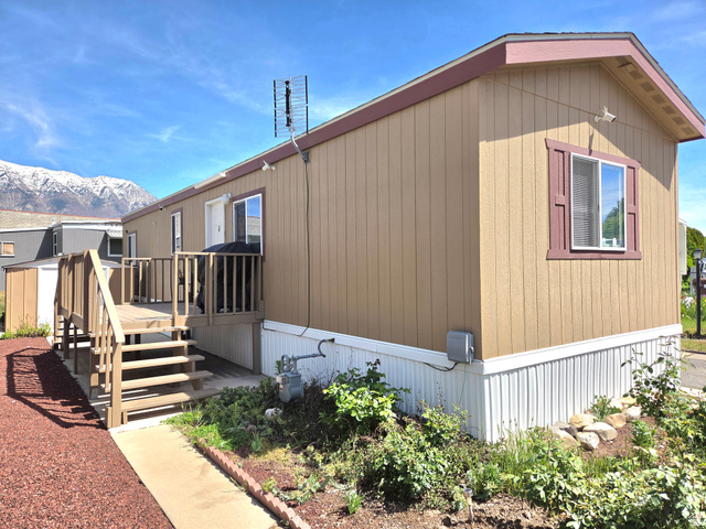 597 North State Street, Unit 67 Orem, UT 84057 - Photo 4 of 23 View of side of home featuring a deck with mountain view and stairs