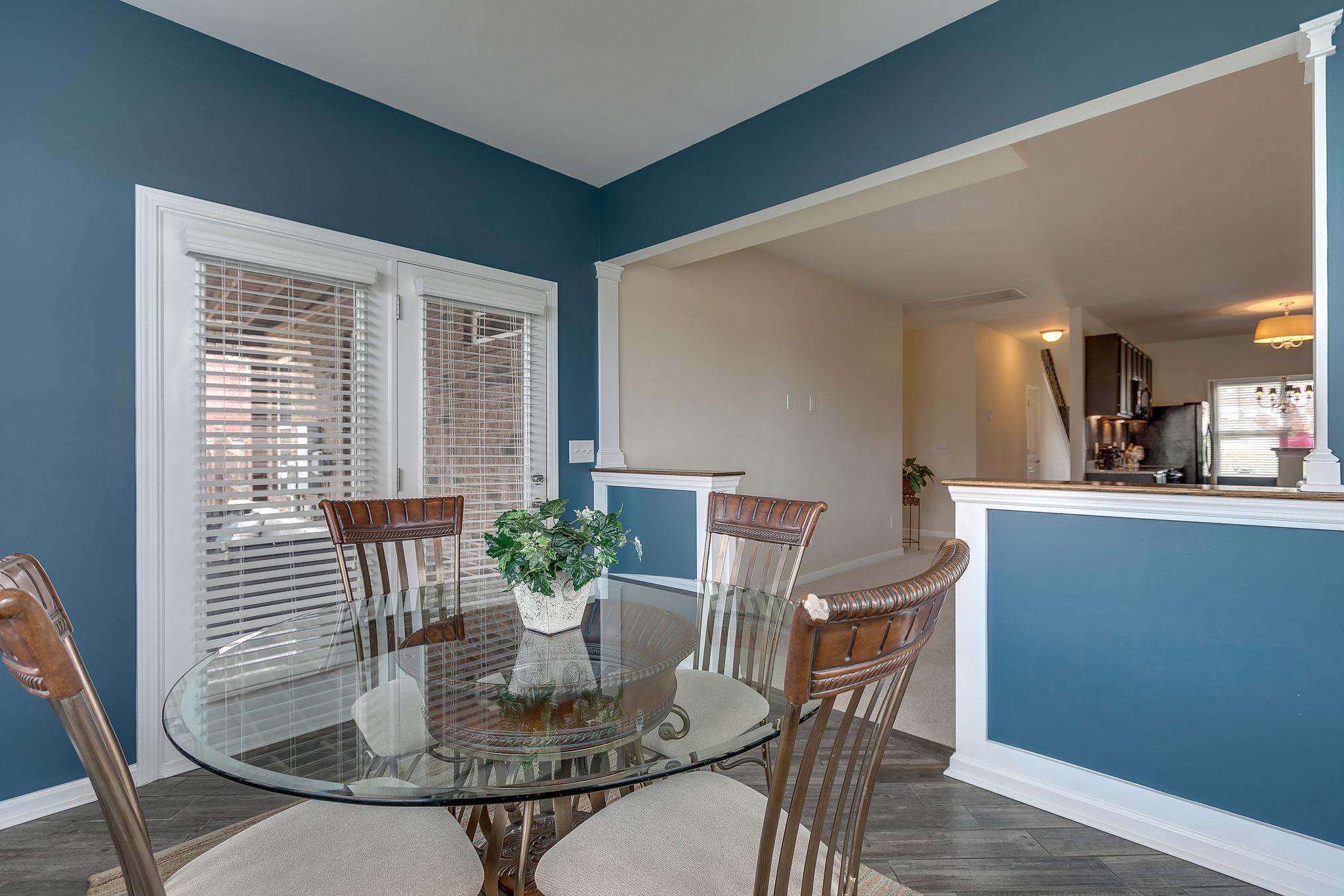 4020 Pendleton Drive Spring Hill, TN 37174 - Photo 17 of 28 The Sun Room makes it way out onto the Serene Custom-Built Patio.