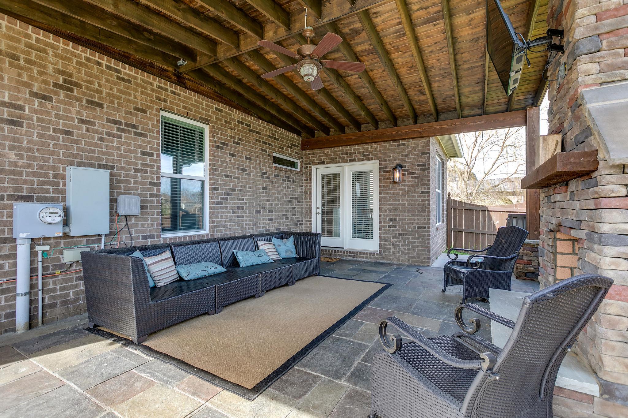 4020 Pendleton Drive Spring Hill, TN 37174 - Photo 23 of 28 Off the Sun Room is an Expansive, Custom-Built Patio w/ Slate Flooring to Enjoy year-round.