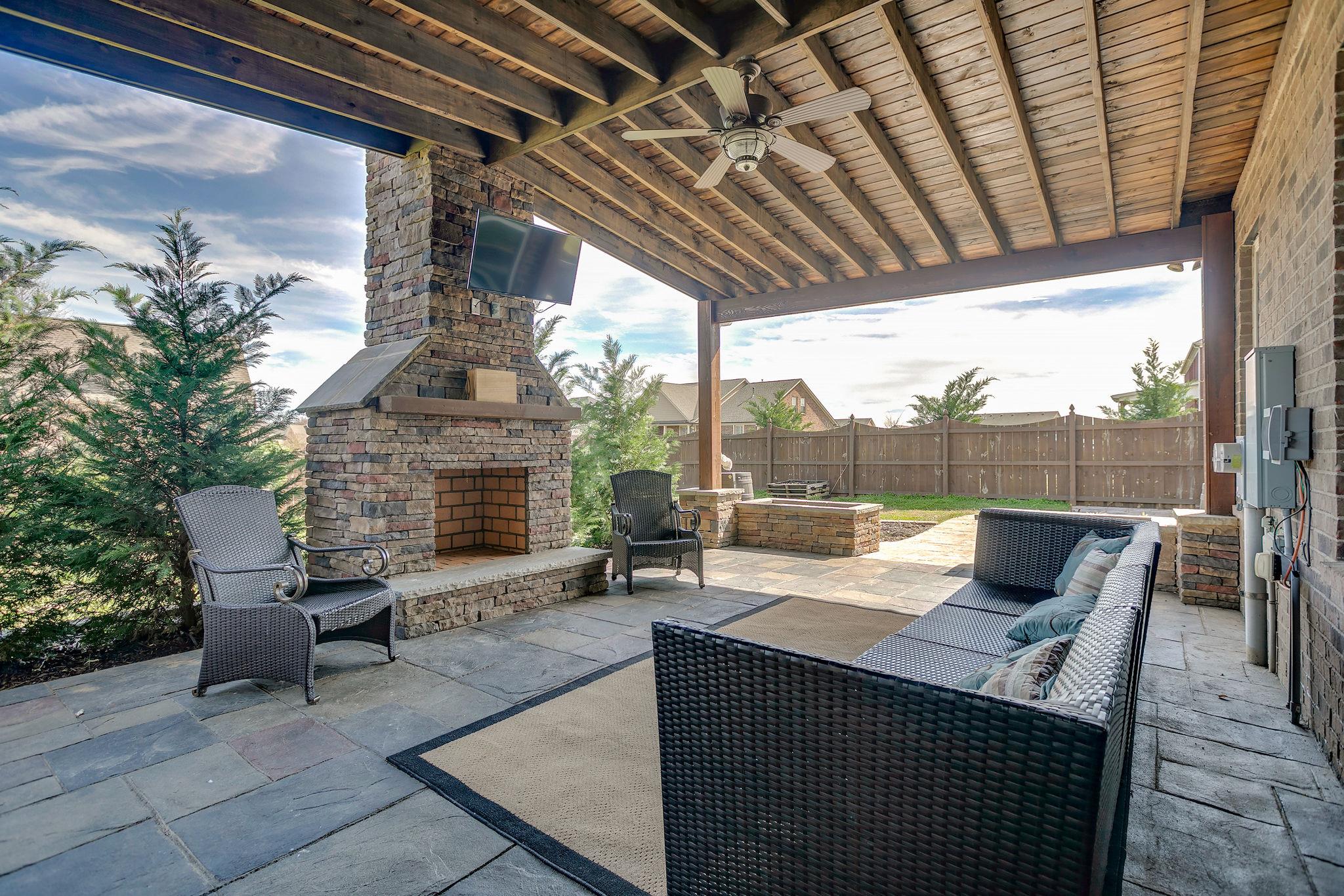 4020 Pendleton Drive Spring Hill, TN 37174 - Photo 24 of 28 The Stone Fireplace keeps the chill off and warms your evenings with family and friends relaxing or enjoying a movie on TV.