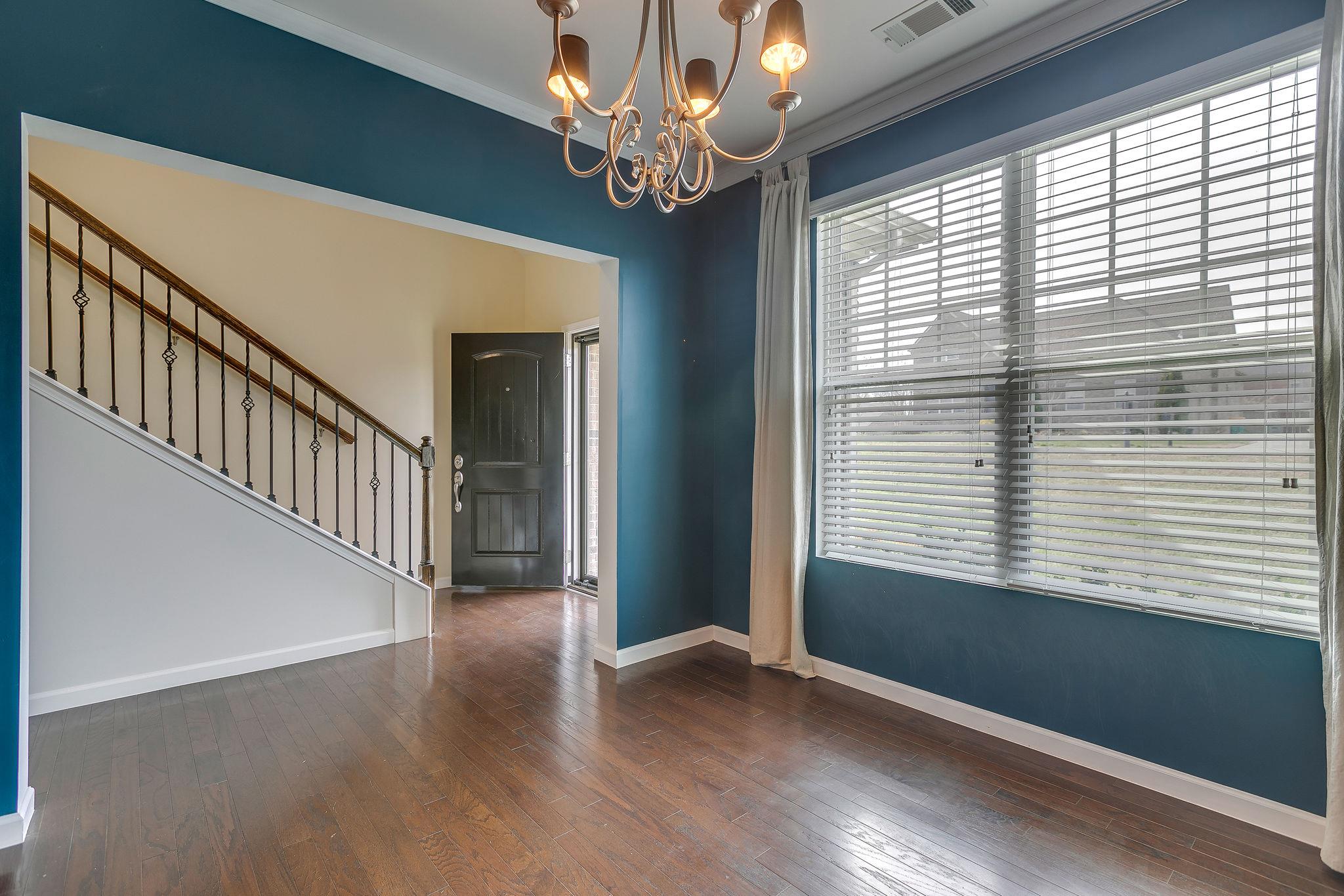 4020 Pendleton Drive Spring Hill, TN 37174 - Photo 9 of 28 This bright Dining Room shows the wood and wrought-iron stairwell leading up to the 2nd Story.