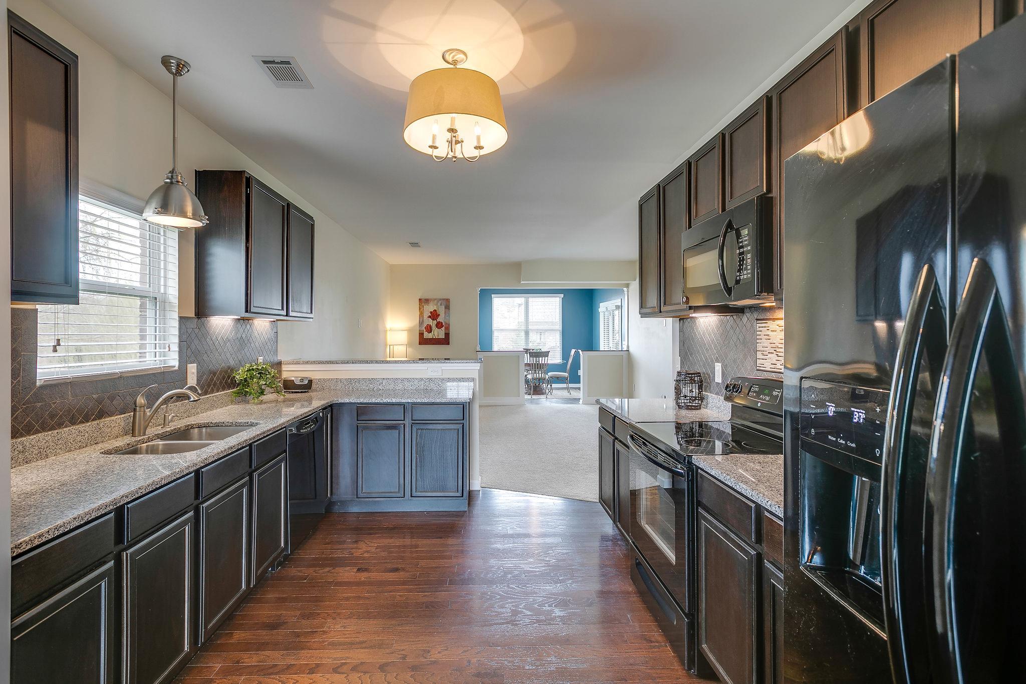 4020 Pendleton Drive Spring Hill, TN 37174 - Photo 10 of 28 Kitchen also features LED lighting under beautiful wood cabinets and Restoration Hardware.