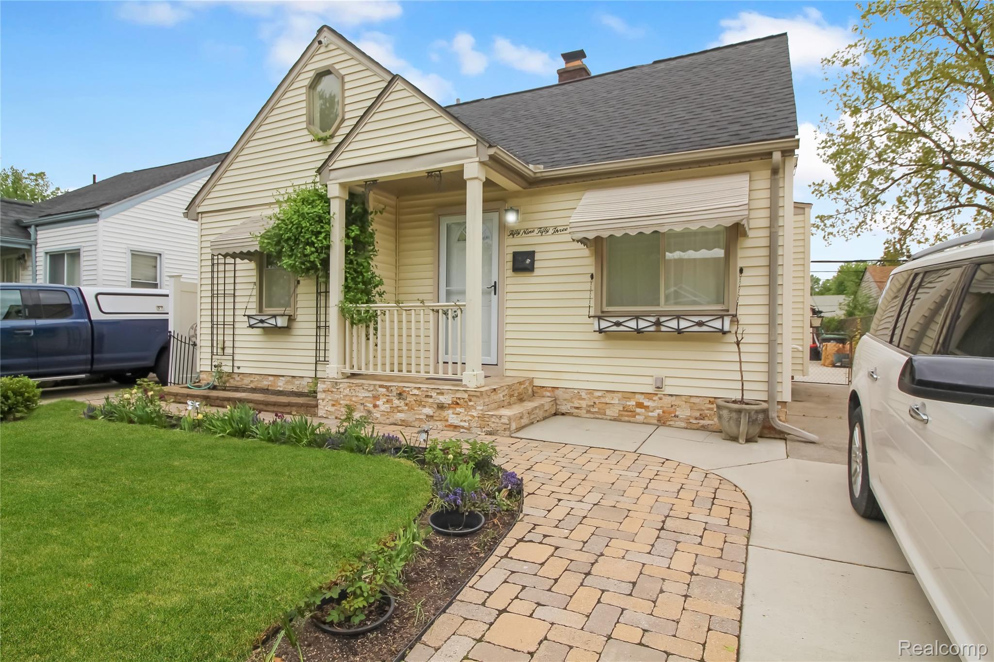 5953 Cooper Street Taylor, MI 48180 - Photo 2 of 33 Front facade featuring light-colored siding and a covered porch