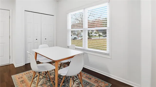 a room with a table and chairs