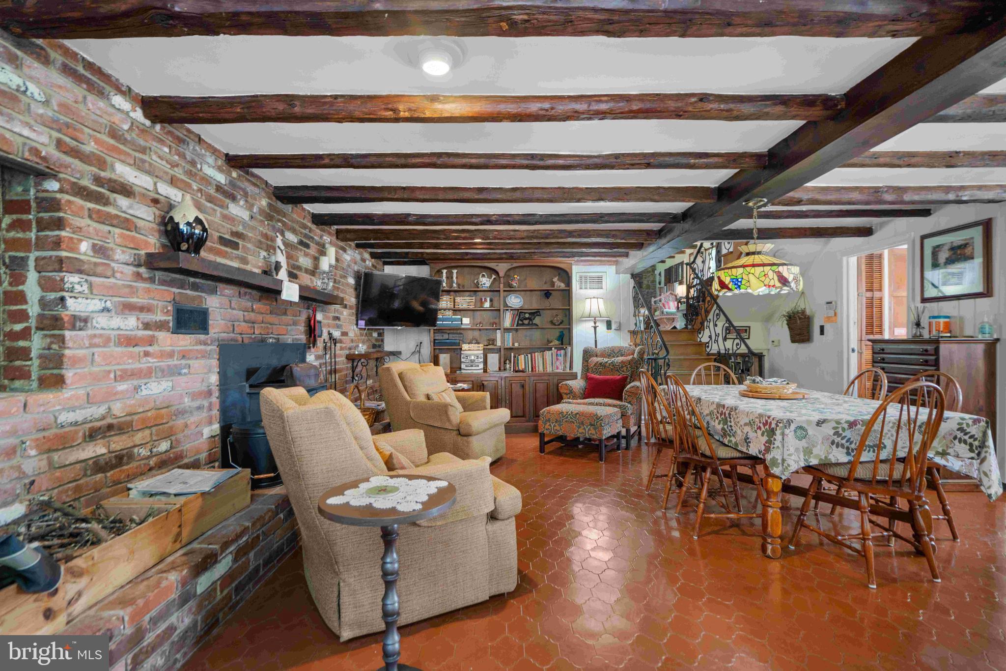 2699 Mauzy Road Berkeley Springs, WV 25411 - Photo 54 of 78 1st level dining area and woodstove