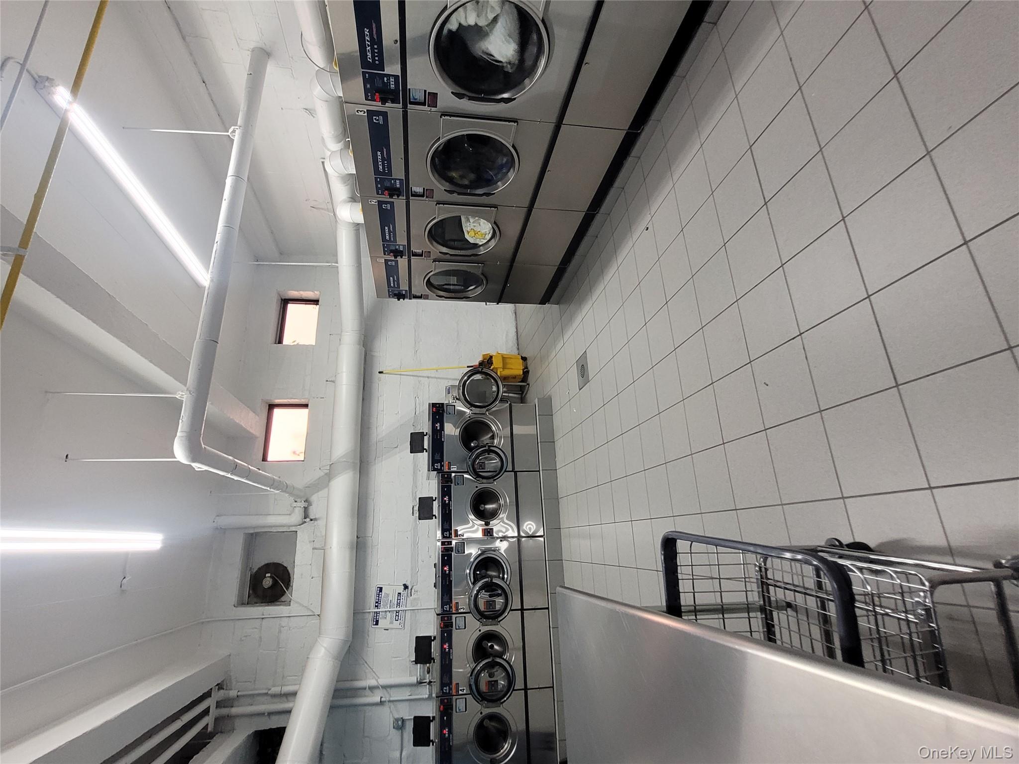 99-30 59th Avenue, Unit 3K Queens, NY 11368 - Photo 14 of 21 a utility room with lots of appliances