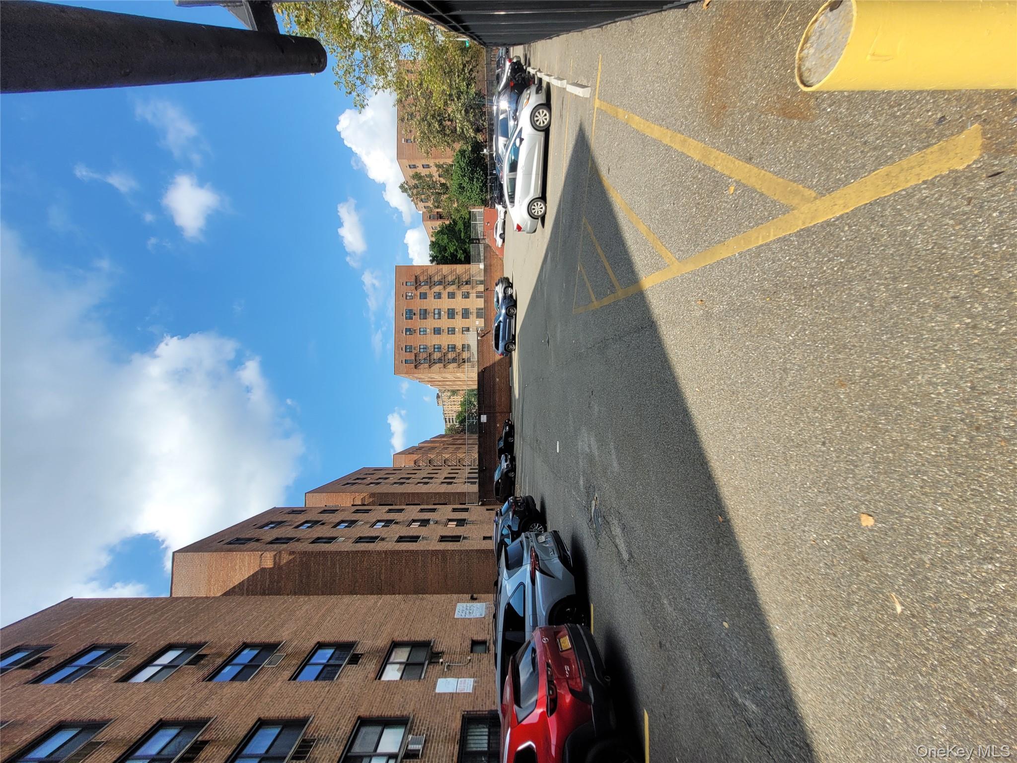 99-30 59th Avenue, Unit 3K Queens, NY 11368 - Photo 20 of 21 a view of a street with cars