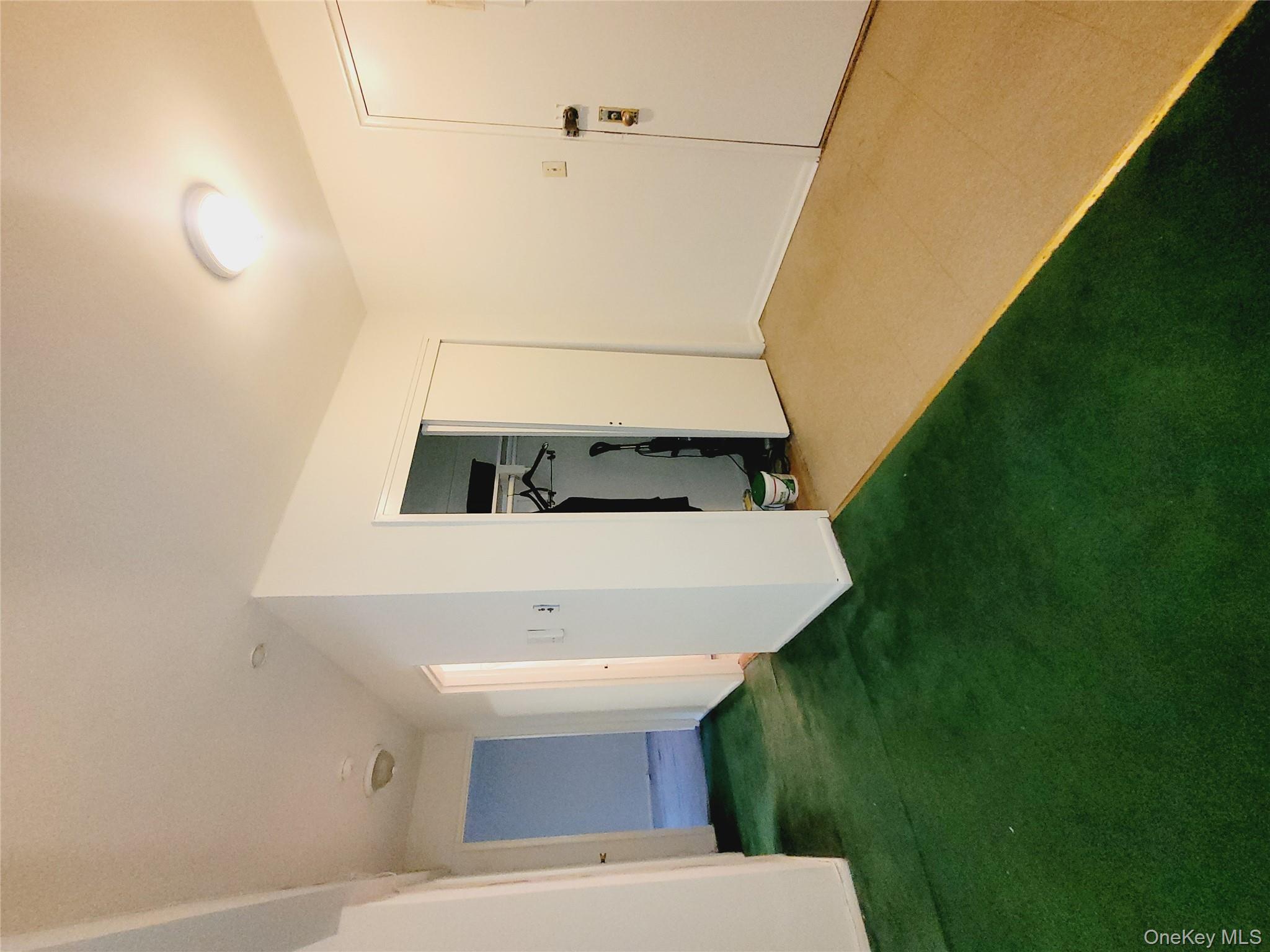 99-30 59th Avenue, Unit 3K Queens, NY 11368 - Photo 7 of 21 a view of an empty room with closet and entryway