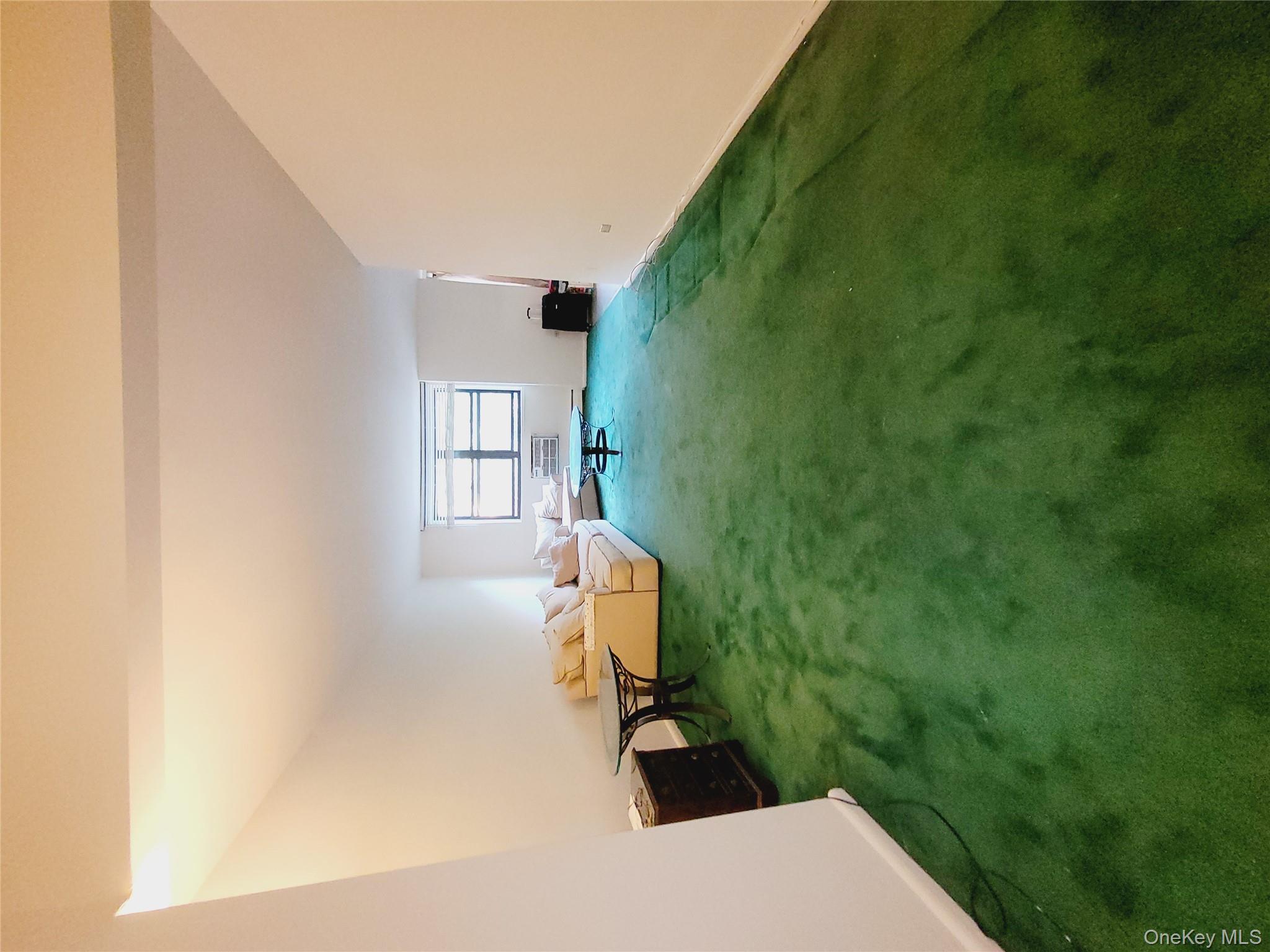 99-30 59th Avenue, Unit 3K Queens, NY 11368 - Photo 8 of 21 a view of a backyard with furniture