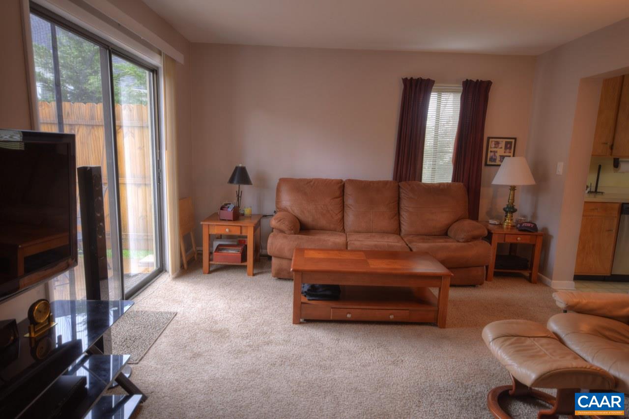 1201 Chatham Ridge Charlottesville, VA 22901 - Photo 11 of 17 a living room with furniture a flat screen tv and a window