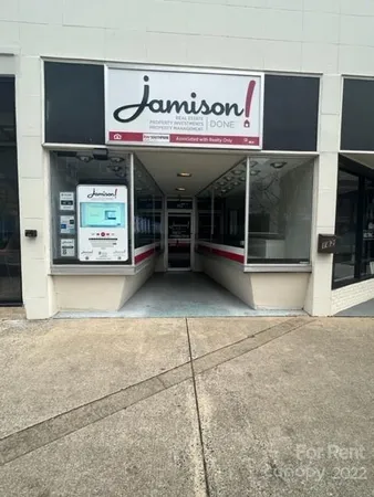 a view of a building with a garage