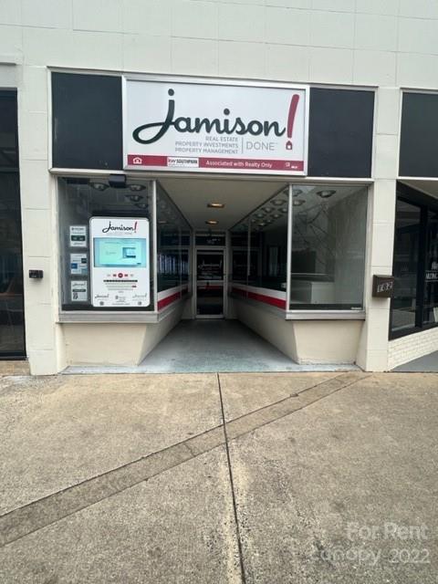 182 West Main Avenue Gastonia, NC 28052 - Photo 2 of 7 a view of a building with a garage
