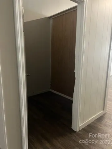 an empty room with wooden floor