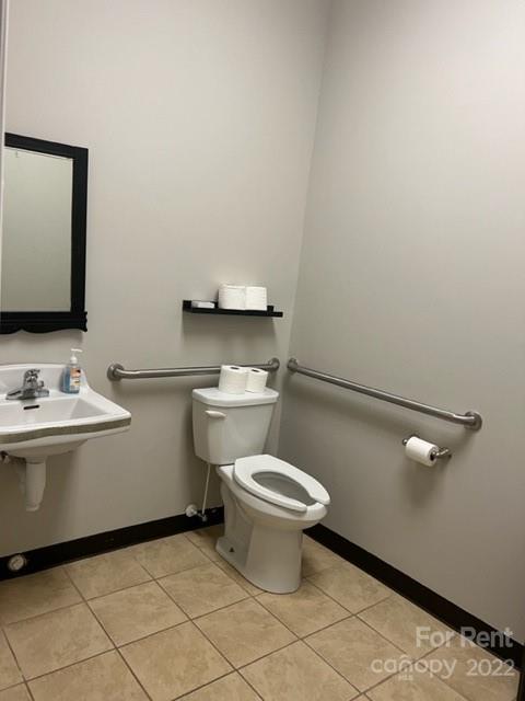 182 West Main Avenue Gastonia, NC 28052 - Photo 6 of 7 a bathroom with a sink toilet and vanity