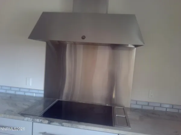 a view of swimming pool with a yard and large tree