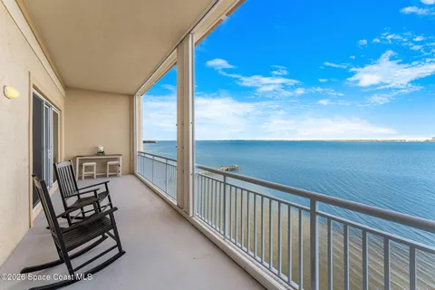 a view of a balcony with chairs