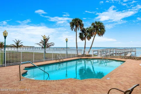 a view of a balcony with an ocean view