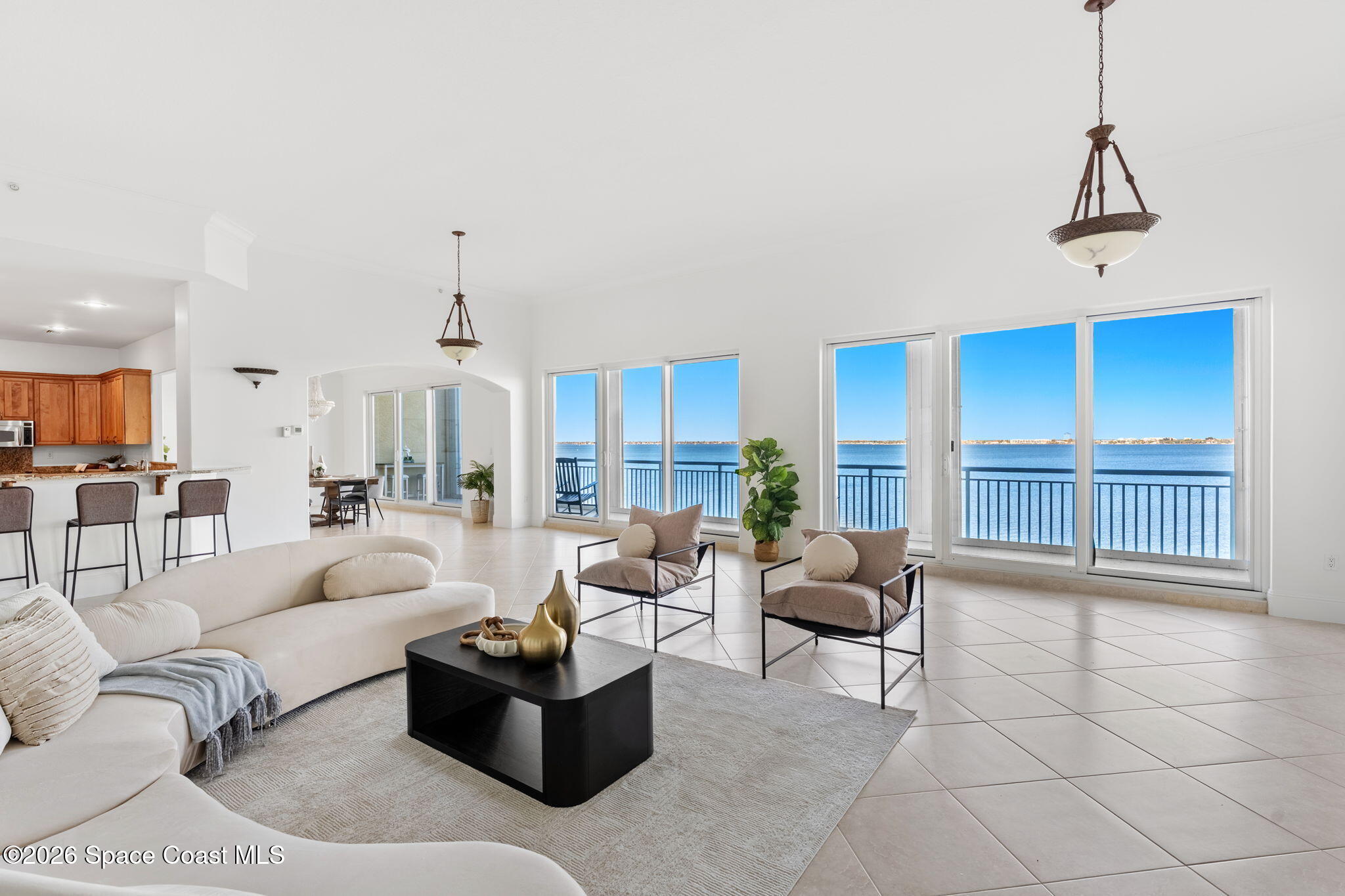 4955 Dixie Highway Northeast, Unit 802 Palm Bay, FL 32905 - Photo 3 of 30 a living room with furniture a chandelier and a large window
