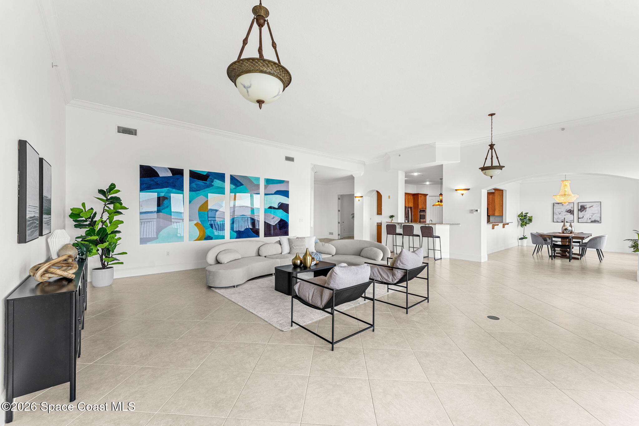 4955 Dixie Highway Northeast, Unit 802 Palm Bay, FL 32905 - Photo 6 of 30 a living room with furniture and a chandelier