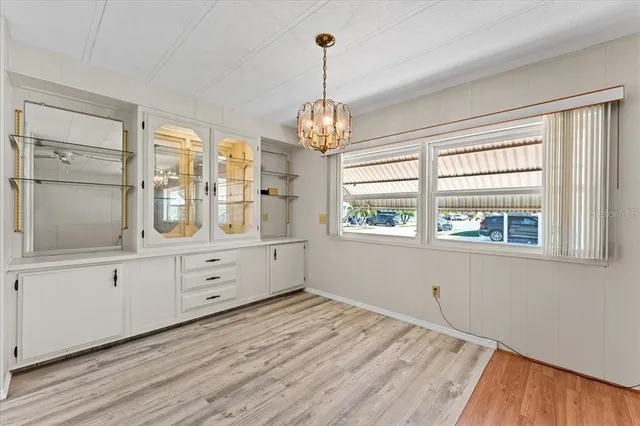 a kitchen with granite countertop a sink stainless steel appliances and cabinets