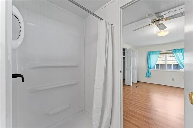 a white couch sitting next to a white toilet