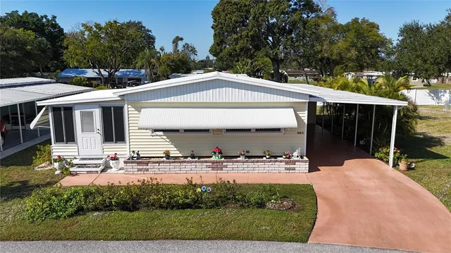 aerial view of a house with a yard
