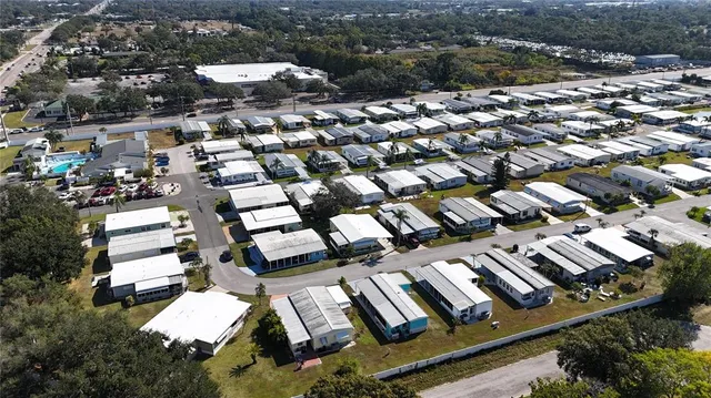 an aerial view of houses with street