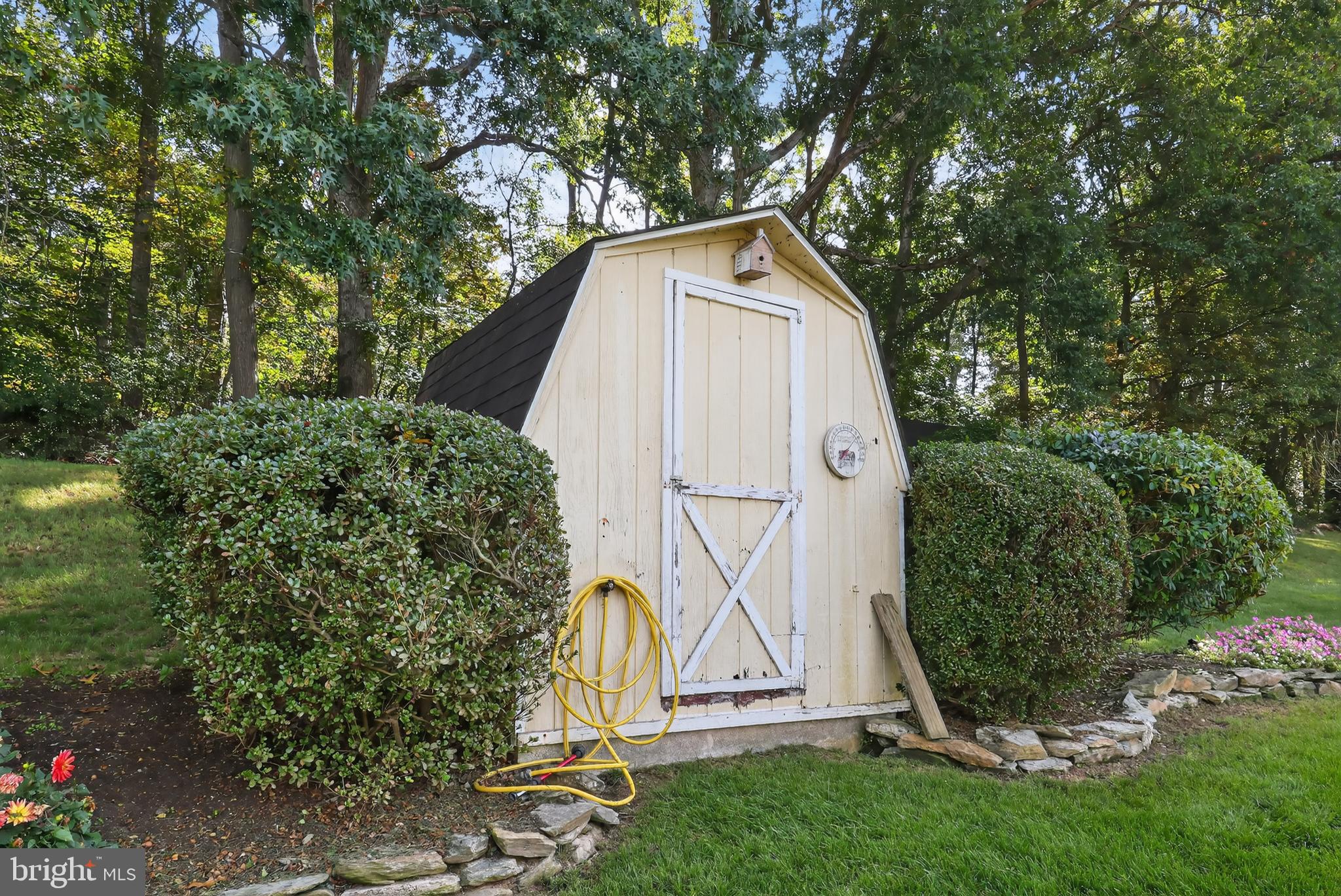 1201 Spruce Grove Road Oxford, PA 19363 - Photo 12 of 32 a view of a backyard with plants and a large tree