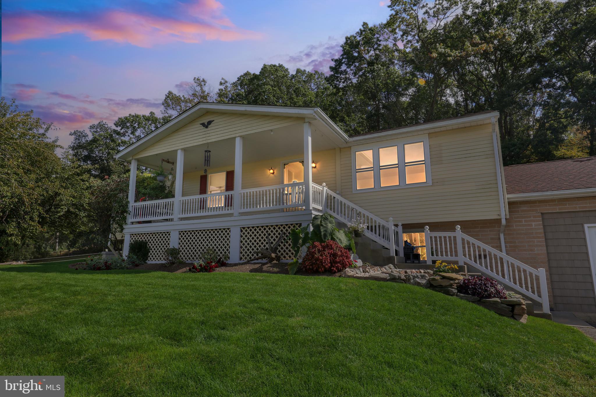 1201 Spruce Grove Road Oxford, PA 19363 - Photo 2 of 32 a front view of a house with a garden
