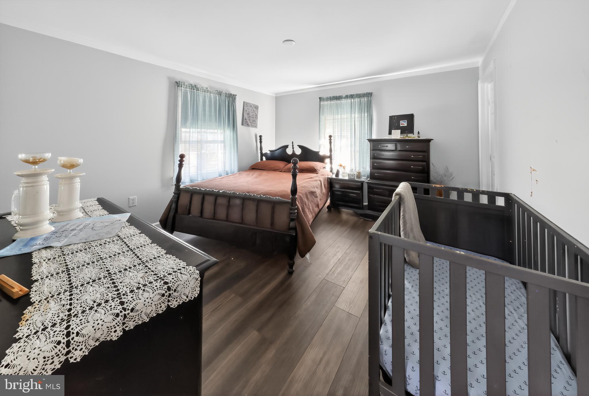 1201 Spruce Grove Road Oxford, PA 19363 - Photo 25 of 32 a bedroom with bed and wooden floor