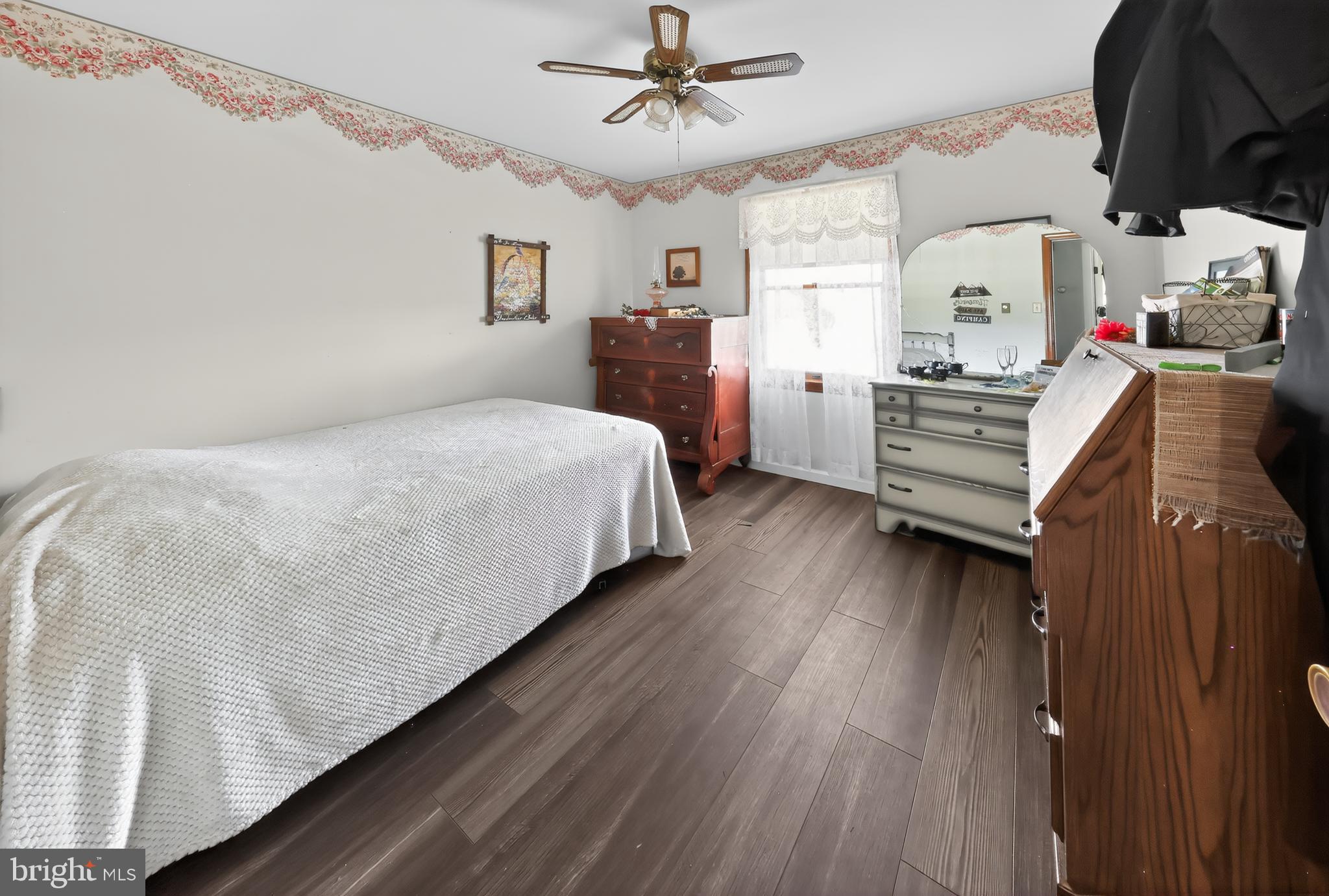 1201 Spruce Grove Road Oxford, PA 19363 - Photo 28 of 32 a bedroom with a bed and dresser with the floor
